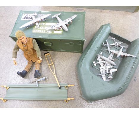 An Action Man figure with a stretcher and dinghy and a collection of die-cast aeroplanes 