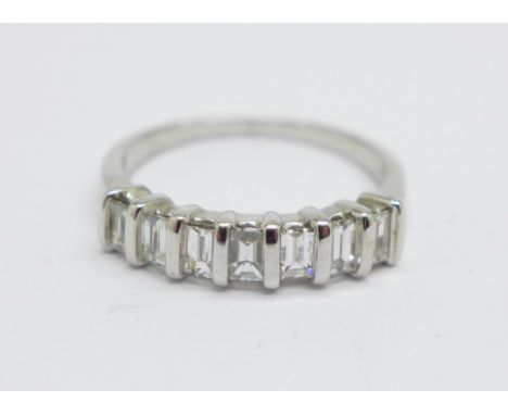 An 18ct white gold and diamond ring, (seven baguette cut diamonds), 0.5carat diamond weight, 2.8g, K 