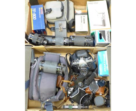 A Canon T-90 35mm film camera, additional lenses, Praktica and Sigma lenses, Pentax Spotmatic 35mm film camera, Voigtlander c