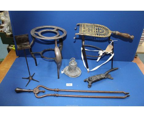 A pierced brass work and wrought iron trivet with hooks for attachment to a fire front, a circular w.i. trivet - the leg unit