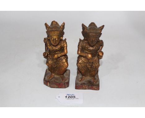 A fine pair of carved and gilded small guardian figures, Cambodia (or Indonesia), 18th -19th c., each 6'' tall.