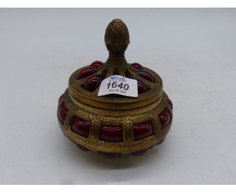 A ruby glass brass caged Trinket box.