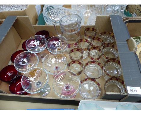 A quantity of glass including champagne bowls with coloured stems, lemonade set, ruby red glasses, etc.