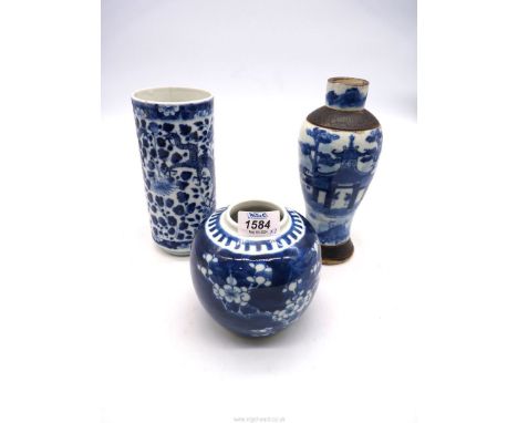 Three pieces of Oriental blue and white china including a Chinese vase decorated with peonies and four toed dragons, four cha