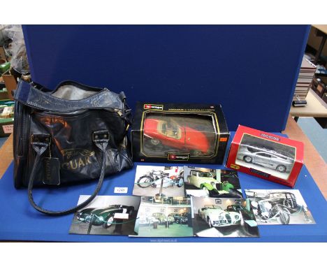 A Jaguar promotional holdall, Burago 1/18 scale 1961 Jaguar E Cabriolet and Maisto 1992 Jaguar XJ220, plus a small quantity o
