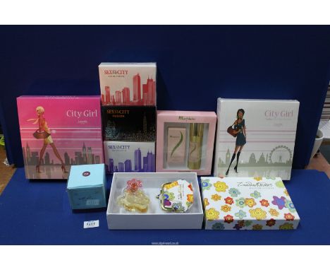 A box of perfumes/cosmetics including boxed Zandra Rhodes 'Button Flower' 50ml eau de parfum and coin purse, two boxed and se