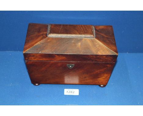 A Rosewood Tea Caddy of sarcophagus form with button feet, 9'' x 5 1/4'' x 5'' high.