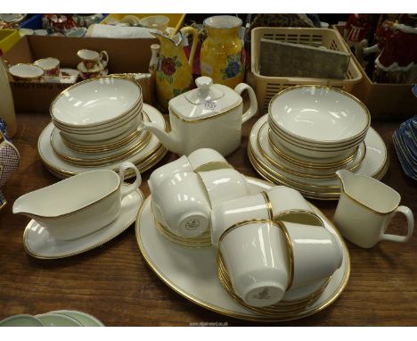 A Royal Doulton 'Gold Concord' part Dinner and tea service to include eight dinner plates, eight side plates, six dessert pla