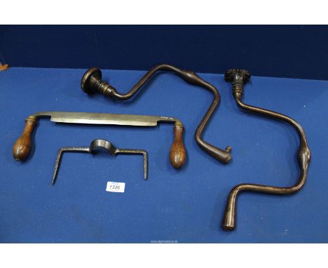 A quantity of carpenter's tools including two wrought iron braces and two draw-knives, one lacking handles but with unusual c
