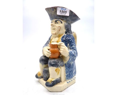 An early 19th Century Pratt type Staffordshire Toby jug 'Sir Toby Philpot' (firing crack to clay pipe) 10 1/4" tall.