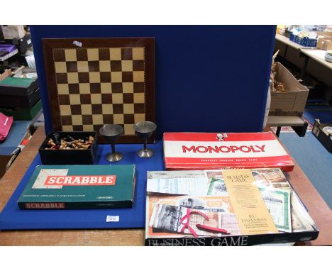 A box of games to include; complete Chess set, Monopoly, Scrabble, etc. Plus two stainless steel goblets.