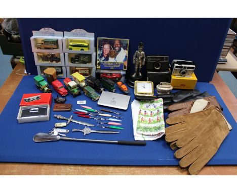 A quantity of miscellanea including; Novelty cigarette lighter (base a/f), driving gloves, collectors model cars, paper knive