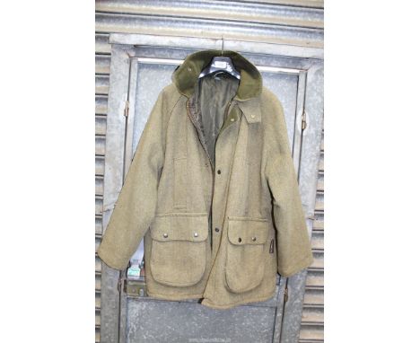 A heavyweight vintage herringbone tweed Overcoat by Woodbury having a quilted lining, size M.