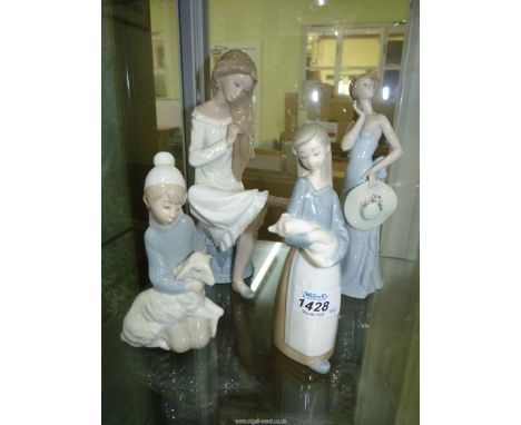 Four figures including three Lladro; Girl with Piglet, Boy with Lamb and Woman Holding her Hat and a Nao figure of a Woman Co