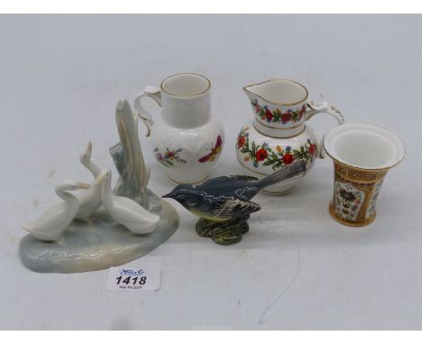 A Nao group of geese, a Worcester miniature jug, a similar poppy jug, a Derby style vase 2 1/2" tall and a Beswick grey wagta