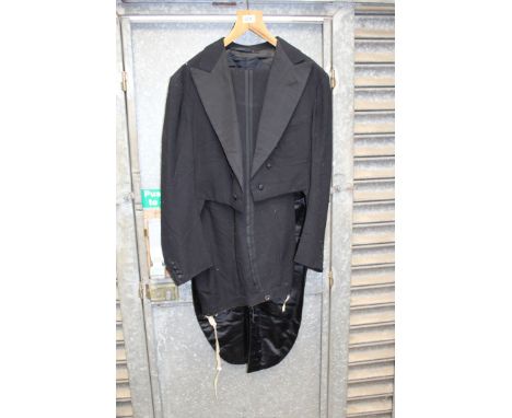 A black Tailcoat suit (for white or black tie), tailcoat having silk lapels, 40" chest (some damage), trousers having button 