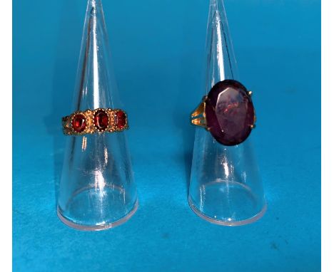 A 9 carat hallmarked gold Victorian style ring set 3 garnets, 2.1 gm; a gold plated ring set large amethyst coloured stone 