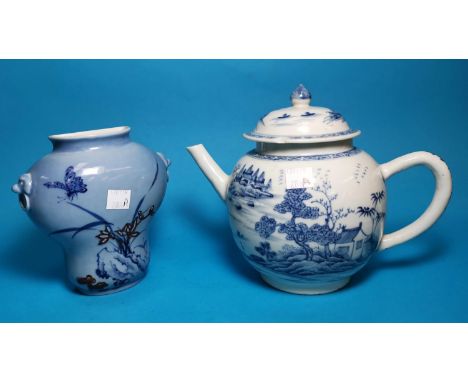 An 18th / 19th century Chinese porcelain teapot decorated in underglaze blue with buildings and trees on islands, length 8.5"