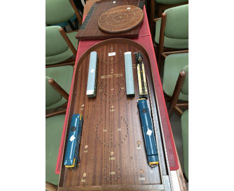 A bagatelle board; a shove ha'penny board; quoits; 2 Dublo electric locos and carriages 