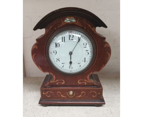 An Edwardian arch top inlaid mantel clock with white enamel dial and balance spring movement 