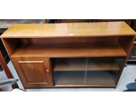 A 1970's teak bookcase 'Stateroom' by Stonehill, with shelf, cupboard and twin sliding glass doors