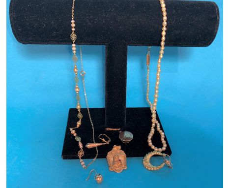 A seed pearl necklace with yellow metal clasp; a religious pendant stamped '18K'; a 9 carat neck chain; 3 other pieces 
