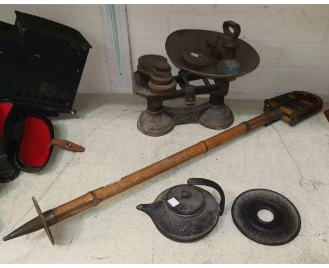 An Edwardian bamboo shooting stick; a set of 19th century kitchen scales  weights; a Chinese cast iron teapot on stand 