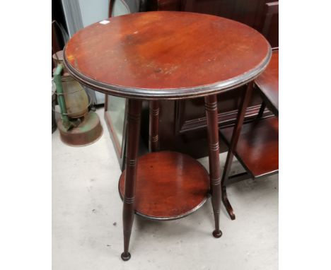 A 1930's circular oak plantstand on bobbin legs 