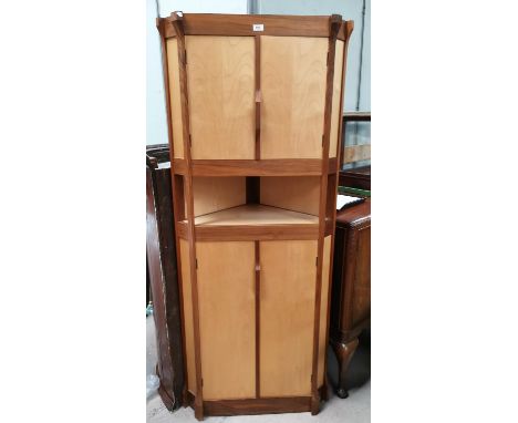 A late 20th Century full height corner cupboard by Gary Olson of Wilmslow in walnut and sycamore, with outset vertical column