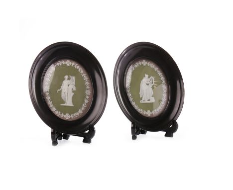 PAIR OF WEDGEWOOD STYLE GREEN JASPERWARE PLAQUESof oval form, depicting classical figures playing the lyre, with white bisque
