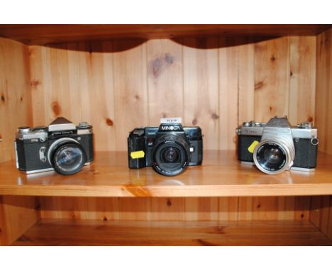 A Prismat camera, a Minolta 7000 camera and a Topcon camera 