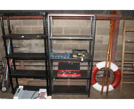 A metal adjustable five tier shelf unit
