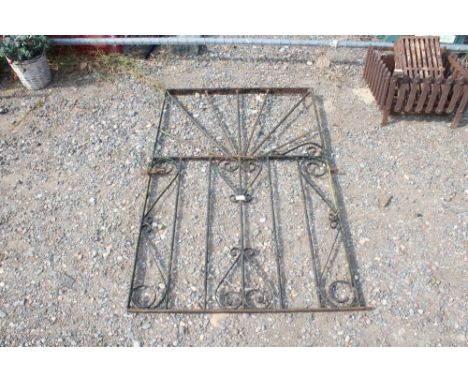 A wrought iron garden gate