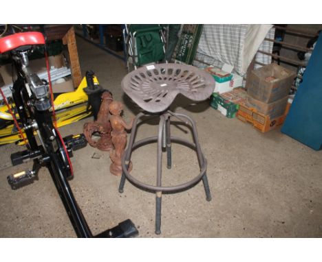 A heavy tractor seat stool (84)