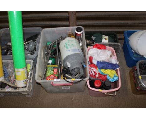 A box containing various gardening items, gloves, hand tools, etc.