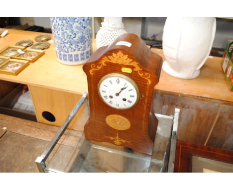 An Edwardian mahogany and inlaid cased two hole mantel clock