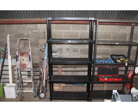 A plastic five tier shelf unit 