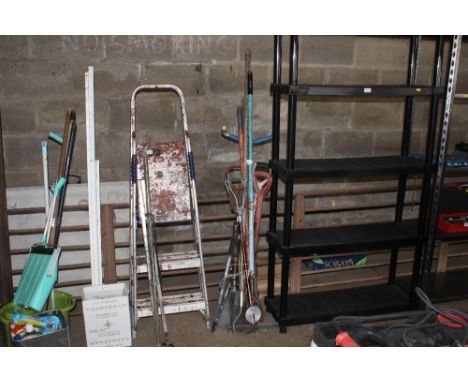 A quantity of gardening tools to include rakes, garden hoe, loppers, collapsible shovel and shooting sticks