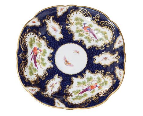 A LATE WORCESTER PORCELAIN PLATE, CIRCA 1780-1800 Of shaped form with... A LATE WORCESTER PORCELAIN PLATE, CIRCA 1780-1800 Of