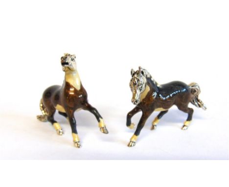 A PAIR OF SATURNO SILVER AND ENAMEL HORSES,  each approx 6cm nose to tail