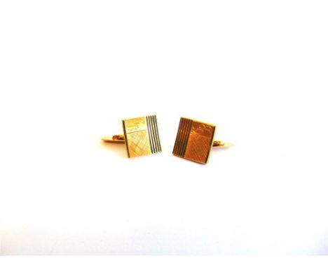 A PAIR OF CUFFLINKS stamped '750', the square matt and engine turned panel monogrammed, 10.4g gross