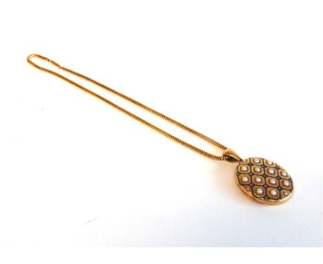 A LATE VICTORIAN LARGE OVAL SPLIT PEARL AND ROSE DIAMOND LOCKET circa 1880, the blue enamel honey comb like pattern enclosing