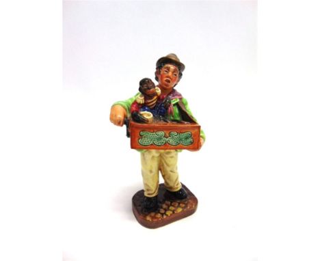 A ROYAL DOULTON FIGURE HN2173 'ORGAN GRINDER',  22cm high