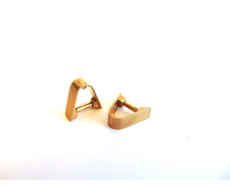 A PAIR OF 9 CARAT GOLD CUFFLINKSLondon 1950, of V shape with engine turning, 12g gross