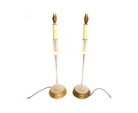 A PAIR OF CONTEMPORARY TABLE LAMP BASES,  with frosted and clear glass on circular spreading metal base, 67cm high