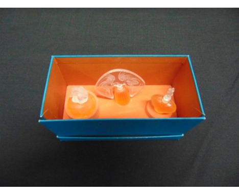 LALIQUE 'LES INTROUVABLES':  a boxed set of three scent bottles: 'Les Ondines', 'Le Nu' and 'Amour', together with a Rene Lal