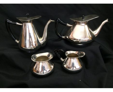 A FOUR PIECE INDIAN TEA AND COFFEE SERVICE, circa 1960, stamped 'Silver Sterling', with composition handles and finials, 1952