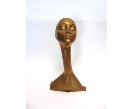 A SHOPFITTING DISPLAY MANNEQUIN HEAD  with elongated neck and gold finish, 57cm high