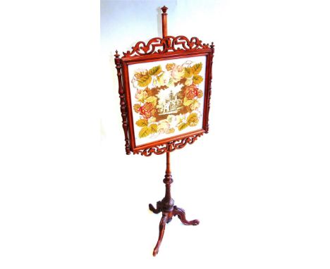 A VICTORIAN CARVED MAHOGANY POLE SCREEN,  with tapestry and beadwork panel in open fret carved frame, 147cm high overall