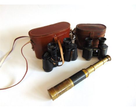 A THREE-DRAW POCKET TELESCOPE late 19th or early 20th century, unsigned, with sliding spray-guard and lens cap, 17.5cm long (